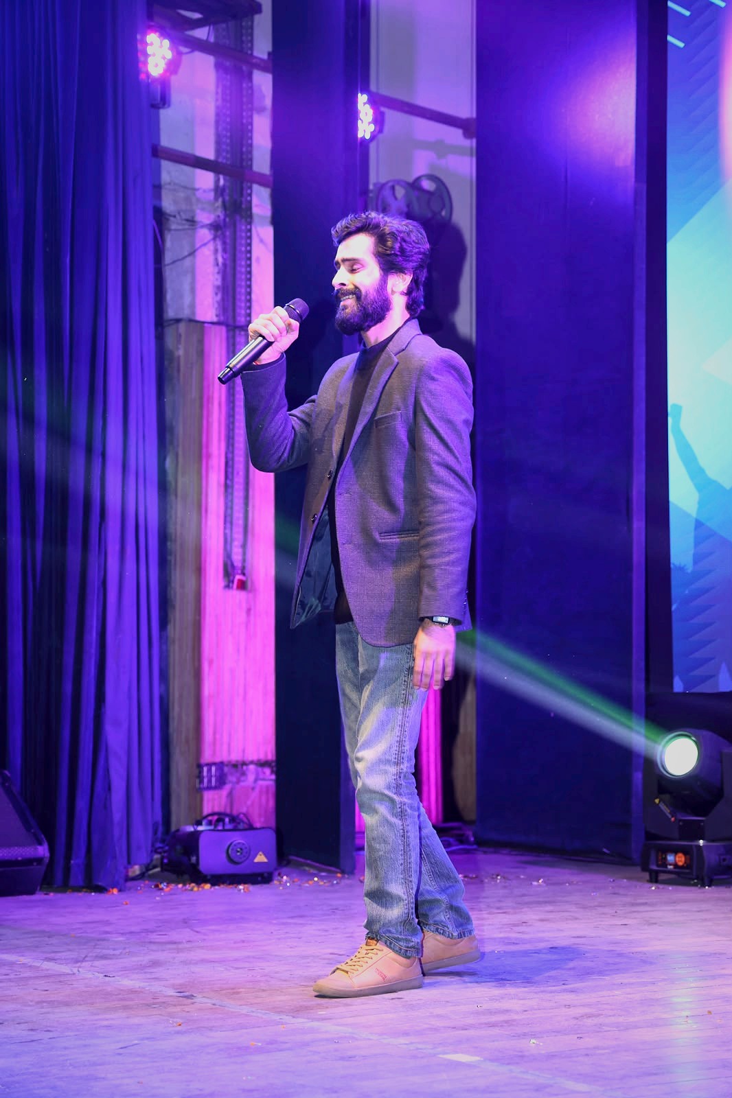 Singer performing on stage at the annual recital