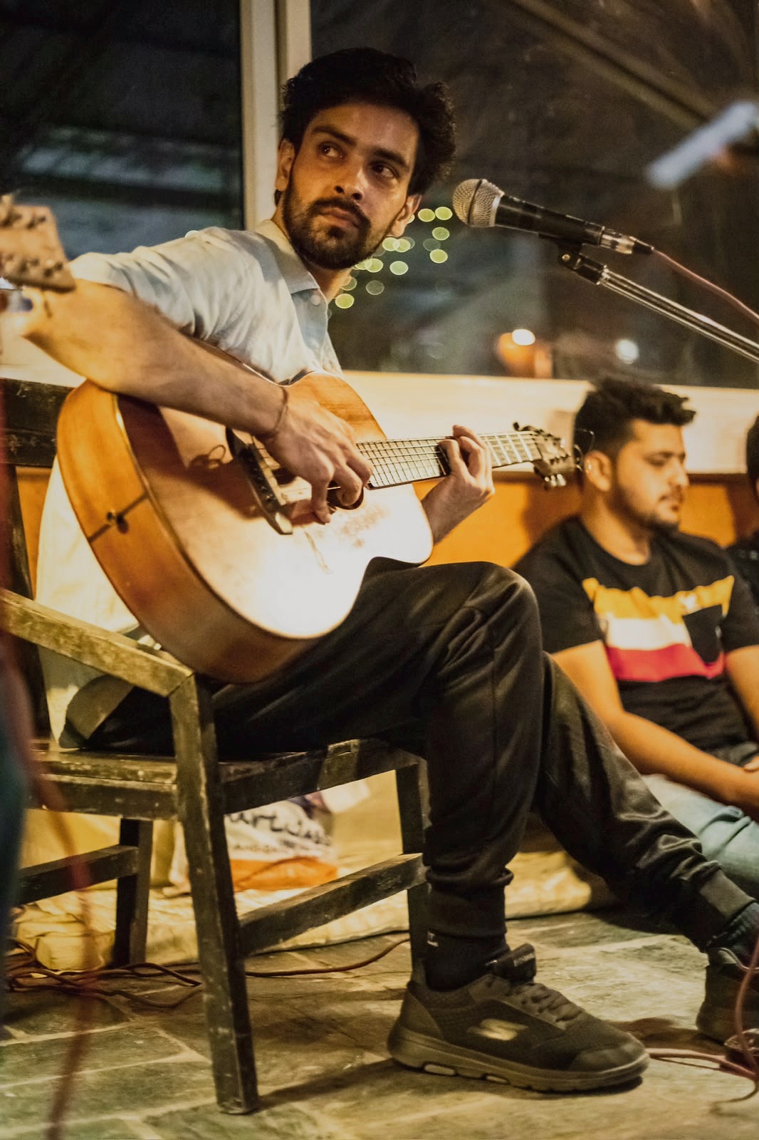 Musician with guitar in a studio